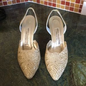Mario Valentino gold lace sling heels.